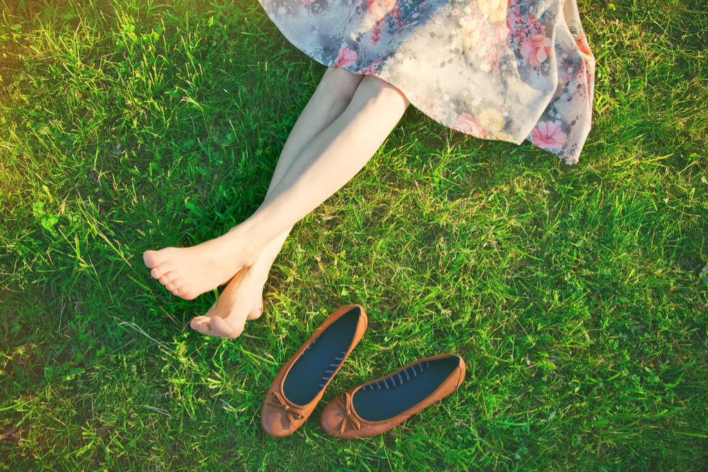 barefoot woman in the grass