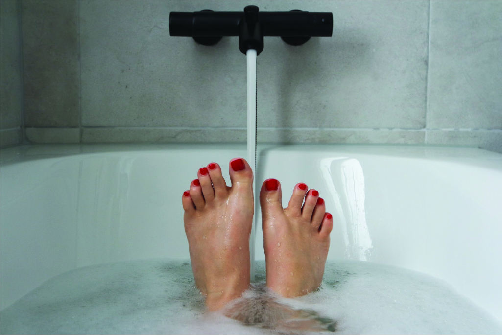 woman's feet in a comfortable bath